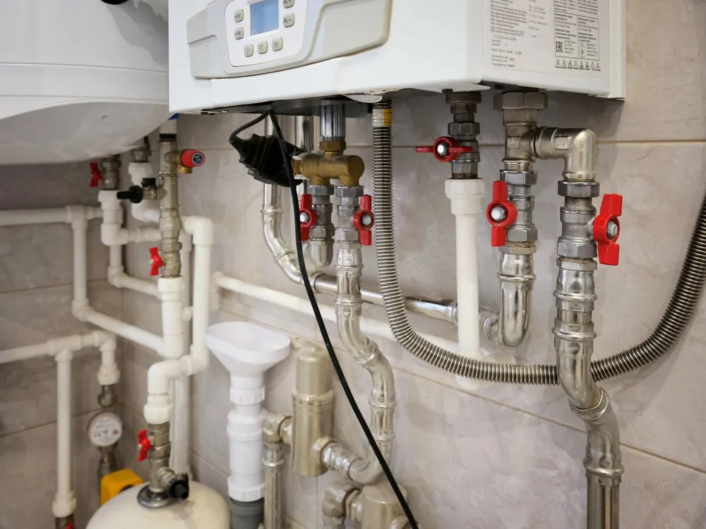 Hot water system installation with pipework and isolation valves